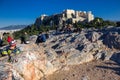 Athens, Greece, January 30 2018: People enjoy the view to the city of Athens from the hill of Areopagus Royalty Free Stock Photo