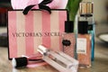 Victoria`s Secret perfum bottles and shopping bag Royalty Free Stock Photo