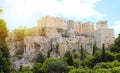 ATHENS, GREECE - JULY 18, 2018: close up view of famous Acropolis with people who visit the Parthenon, Erechtheum, Propylaea and Royalty Free Stock Photo