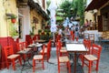 ATHENS, GREECE - JULY 18, 2018: cozy greek street with tourists in cafe e restaurante, Athens, Greece