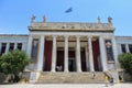 Looking outside at the front of the world famous National Archaeological Museum in Athens, Greece.  Several visitors are walking t Royalty Free Stock Photo