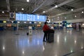 Airport terminal building interior. Checkin counters and blue information signs. Athens Greece