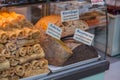 Traditional Greek snacks and pastry products on a shop window in Athens, Greece