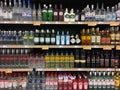 Vodka gin tequila and rum bottles on liquor store shelves