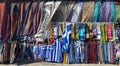 Multicolored textile of scarf and pareo and flags for sale on the Monastiraki flea market in Athens, Greece