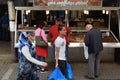 People buy dried fruit and nuts at street market Royalty Free Stock Photo