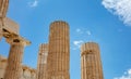 Athens, Greece. Propylaea columns in the Acropolis, blue cloudy sky in spring sunny day Royalty Free Stock Photo