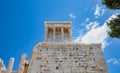 Athens, Greece. Propylaea and Temple of Athena Nike in the Acropolis, monumental gate, blue cloudy sky in spring sunny day Royalty Free Stock Photo