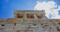 Athens, Greece. Propylaea and Temple of Athena Nike in the Acropolis, monumental gate, blue cloudy sky in spring sunny day Royalty Free Stock Photo