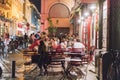 ATHENS, GREECE - SEPTEMBER 16, 2018: Night views of Athens city. People relaxing after work. Outdoor restaurant at Plaka