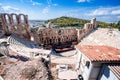 Odeon of Herodes Atticus with tourists looking at it Royalty Free Stock Photo