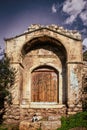 Athens Greece - Small ancient building near Accropolis and Tower of Winds in Athens with boarded up door and cat Royalty Free Stock Photo