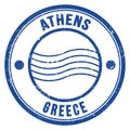 ATHENS - GREECE, words written on light bue postal stamp Royalty Free Stock Photo