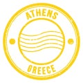 ATHENS - GREECE, words written on yellow postal stamp Royalty Free Stock Photo