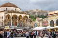 Monastiraki square with old mosque and view of Acropolis in Athens, Greece. People visit an Athens city center in summer Royalty Free Stock Photo