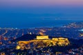 Athens postcard. Sunset view of Parthenon Temple at the Acropolis Hill, Athens and harbour. View from Mount Lycabettus. Athens, Royalty Free Stock Photo