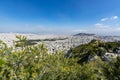 Athens in spring, view from hill, cityscape with streets and buildings, ancient urbal culture