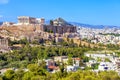 Athens in summer, Greece. Famous Acropolis hill rises above cityscape