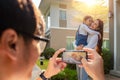 Ather take a picture a mother and daughter in new house with sun set by he smart phone Royalty Free Stock Photo