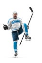 Athlete in action. Very emotional hockey player with stick and puck in his hands. Sports emotions. Hockey athlete with Royalty Free Stock Photo