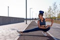 Athlete afro woman stretching hamstring leg muscles during outdoor running workout Royalty Free Stock Photo