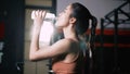 Athlete Asian Woman Drinking Pure Water After Workout Exercise or Training Building Muscles