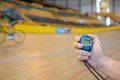 Athlete with bicycle at velodrome