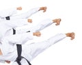 An athlete with a black belt is beating three high kick collage