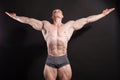 The athlete bodybuilder shows his muscles after sports Royalty Free Stock Photo