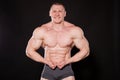 The athlete bodybuilder shows his muscles after sports Royalty Free Stock Photo