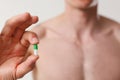 Athlete bodybuilder takes dope in the form of tablets form of pharma rapid progress in muscle Royalty Free Stock Photo