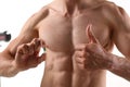Athlete bodybuilder takes dope in the form of tablets form of pharma rapid progress in muscle Royalty Free Stock Photo