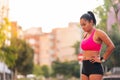 athlete catching breath during her workout