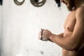 Athlete clapping hands with talc before deadlift barbells workout Royalty Free Stock Photo