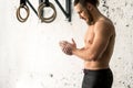 Athlete clapping hands with talc before deadlift barbells workout Royalty Free Stock Photo