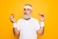 Athlete cool grandpa holds forbidden junkfood cheeseburger and f Royalty Free Stock Photo