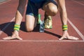 Athlete Crouching at Running Track Starting Blocks Royalty Free Stock Photo
