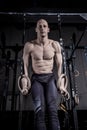 Athlete Doing Push Up With Rings at Gym. Royalty Free Stock Photo