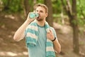 Athlete drink water. Water balance. Athlete hold bottle care hydration body. Thirsty after morning jog. Refreshing Royalty Free Stock Photo