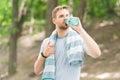 Athlete drink water. Water balance. Athlete hold bottle care hydration body. Thirsty after morning jog. Refreshing Royalty Free Stock Photo