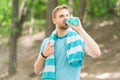 Athlete drink water. Water balance. Athlete hold bottle care hydration body. Thirsty after morning jog. Refreshing Royalty Free Stock Photo