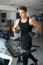 Athlete exercising on a stationary bike Royalty Free Stock Photo