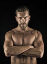 Athlete with folded hands on muscular bare torso, chest, belly Royalty Free Stock Photo