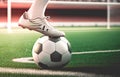 athlete foot kicking soccer ball on a pitch, for Sport concept. Generative AI Royalty Free Stock Photo