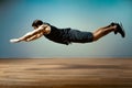 The athlete gave a push-up exercise with a jump. Flight phase. Functional training.