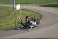 Athlete Girl with Helmet Riding her Hand Bike on a Track