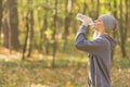 Girl taking a break during run to hydrate. Healthy and sport concept