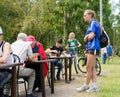 Athlete girl watching a game of chess in the amateur competition