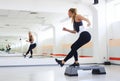 Athlete having a step aerobics in a gym Royalty Free Stock Photo