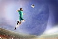 Athlete heading soccer ball in stadium Royalty Free Stock Photo